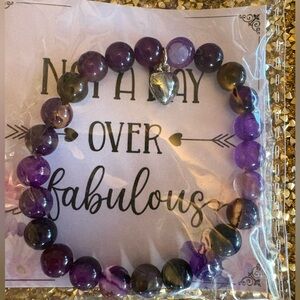 Purple NWT “Not A Day Over Fabulous” Beaded Bracelet with Heart Charm.